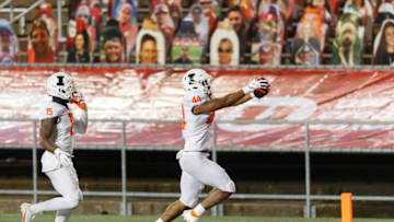 Oct 23, 2020; Madison, Wisconsin, USA; Illinois Fighting Illini linebacker Tarique Barnes (44) returns a fumble for a touchdown during the second quarter against the Wisconsin Badgers at Camp Randall Stadium. Mandatory Credit: Jeff Hanisch-USA TODAY Sports