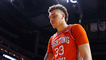 DES MOINES, IOWA - MARCH 16: Coleman Hawkins #33 of the Illinois Fighting Illini looks dejected as they leave the courted after being defeated by Arkansas Razorbacks 73-63 in the first round of the NCAA Men's Basketball Tournament at Wells Fargo Arena on March 16, 2023 in Des Moines, Iowa. (Photo by Michael Reaves/Getty Images)