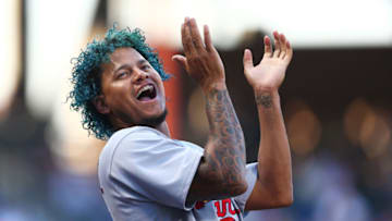 NEW YORK, NEW YORK - JULY 19: Carlos Martinez #18 of the St. Louis Cardinals cheers from the dugout in the first inning against the New York Mets at Citi Field on July 19, 2017 in the Flushing neighborhood of the Queens borough of New York City. (Photo by Mike Stobe/Getty Images)