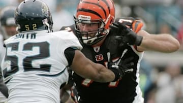 October 9, 2011; Jacksonville FL, USA; Jacksonville Jaguars linebacker Daryl Smith (52) tries to get by Cincinnati Bengals offensive tackle Andrew Whitworth (77) in the fourth quarter of the game at EverBank Field. The Bengals beat the Jaguars 30-20. Mandatory Credit: Phil Sears-USA TODAY Sports