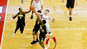 COLUMBUS, OH - FEBRUARY 10: Maishe Dailey #1 of the Iowa Hawkeyes and Micah Potter #0 of the Ohio State Buckeyes compete for a rebound during the game at Value City Arena on February 10, 2018 in Columbus, Ohio. Ohio State defeated Iowa 82-64. (Photo by Kirk Irwin/Getty Images)