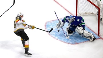Reilly Smith #19 of the Vegas Golden Knights attempts a shot on Thatcher Demko #35 of the Vancouver Canucks during the first period in Game Six of the Western Conference Second Round. (Photo by Bruce Bennett/Getty Images)