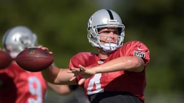 Aug 2, 2015; Napa, CA, USA; Oakland Raiders quarterback Derek Carr (4) throws a pass at training camp at the Napa Valley Marriott. Mandatory Credit: Kirby Lee-USA TODAY Sports