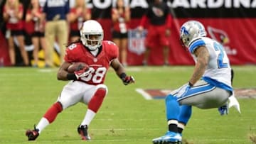 Sep 15, 2013; Phoenix, AZ, USA; Arizona Cardinals running back Andre Ellington (38) runs with the ball as Detroit Lions strong safety Glover Quin (27) defends during the second half at University of Phoenix Stadium. Mandatory Credit: Matt Kartozian-USA TODAY Sports