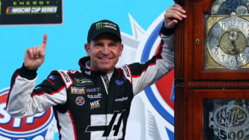 MARTINSVILLE, VA - MARCH 26: Clint Bowyer, driver of the #14 Haas Automation Demo Day Ford, celebrates with the trophy in Victory Lane after winning the weather delayed Monster Energy NASCAR Cup Series STP 500 at Martinsville Speedway on March 26, 2018 in Martinsville, Virginia. (Photo by Sarah Crabill/Getty Images)
