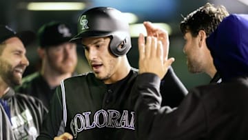 Aug 5, 2016; Denver, CO, USA; Colorado Rockies third baseman Nolan Arenado (28) celebrates in the dugout after scoring in the eighth inning against the Miami Marlins at Coors Field. Mandatory Credit: Isaiah J. Downing-USA TODAY Sports