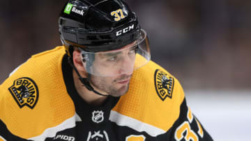 BOSTON, MASSACHUSETTS - APRIL 11: Patrice Bergeron #37 of the Boston Bruins looks on during the third period against the Washington Capitals at TD Garden on April 11, 2023 in Boston, Massachusetts. The Bruins defeat the Capitals 5-2, setting the new NHL record for most points in a single season with 133. (Photo by Maddie Meyer/Getty Images)