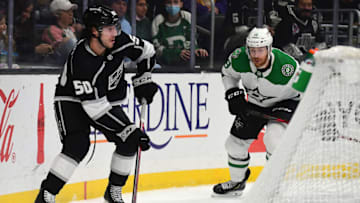 Dec 9, 2021; Los Angeles, California, USA; Los Angeles Kings defenseman Sean Durzi (50) controls the puck as Dallas Stars left wing Michael Raffl (18) moves in during the first period at Staples Center. Mandatory Credit: Gary A. Vasquez-USA TODAY Sports