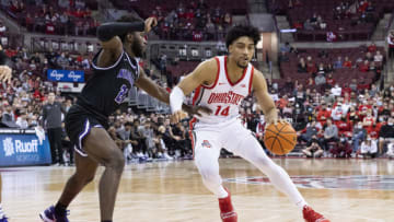 Nov 12, 2021; Columbus, Ohio, USA; Ohio State Buckeyes forward Justice Sueing (14) drives past Niagara Purple Eagles guard Noah Thomasson (21) in the second half at Value City Arena. Mandatory Credit: Greg Bartram-USA TODAY Sports