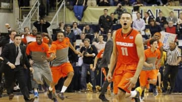 Feb 12, 2014; Pittsburgh, PA, USA; Syracuse Orange guard Tyler Ennis (11) and the Orange bench react after Ennis shoots a three point basket to defeat the Pittsburgh Panthers at the Petersen Events Center. Syracuse won 58-56. Mandatory Credit: Charles LeClaire-USA TODAY Sports