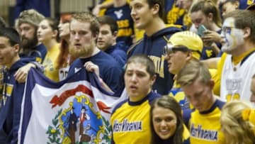 Jan 9, 2016; Morgantown, WV, USA; West Virginia Mountaineers fans and cheerleaders celebrate after beating the Oklahoma State Cowboys at the WVU Coliseum. Mandatory Credit: Ben Queen-USA TODAY Sports