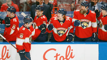 SUNRISE, FL - DECEMBER 16: Matt Kiersted #8 of the Florida Panthers is congratulated by teammates on the bench after Kiersted scored his first NHL goal during first period action against the Los Angeles Kings at the FLA Live Arena on December 16, 2021 in Sunrise, Florida. (Photo by Joel Auerbach/Getty Images)