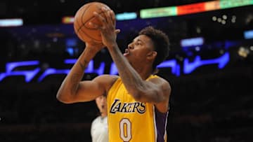 October 28, 2015; Los Angeles, CA, USA; Los Angeles Lakers forward Nick Young (0) attempts a shot against the Minnesota Timberwolves during the first half at Staples Center. Mandatory Credit: Gary A. Vasquez-USA TODAY Sports