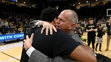 Feb 26, 2022; Boulder, Colorado, USA; Colorado Buffaloes head coach Tad Boyle and forward Evan Battey (21) prior to the game against the Arizona Wildcats at the CU Events Center. Mandatory Credit: Ron Chenoy-USA TODAY Sports