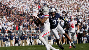 Oct 29, 2022; University Park, Pennsylvania, USA; Ohio State Buckeyes wide receiver Emeka Egbuka (2) hauls in a deep pass behind Penn State Nittany Lions wide receiver Parker Washington (3) during the fourth quarter of the NCAA Division I football game at Beaver Stadium. Mandatory Credit: Adam Cairns-The Columbus DispatchNcaa Football Ohio State Buckeyes At Penn State Nittany Lions