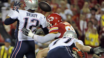 Sep 29, 2014; Kansas City, MO, USA; Kansas City Chiefs outside linebacker Tamba Hali (91) causes a fumble from New England Patriots quarterback Tom Brady (12) in the second half at Arrowhead Stadium. Kansas City won 41-14. Mandatory Credit: John Rieger-USA TODAY Sports