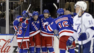 Apr 5, 2016; New York, NY, USA; New York Rangers center Derek Stepan (21) celebrates with teammates after scoring a goal against the Tampa Bay Lightning during the second period at Madison Square Garden. Mandatory Credit: Adam Hunger-USA TODAY Sports