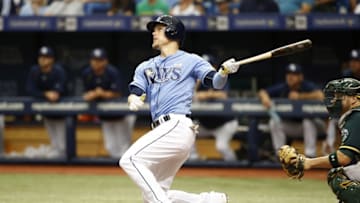 May 15, 2016; St. Petersburg, FL, USA; Tampa Bay Rays left fielder Brandon Guyer (5) hits a three run home run during the second inning against the Oakland Athletics at Tropicana Field. Mandatory Credit: Kim Klement-USA TODAY Sports