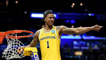 LOS ANGELES, CA - MARCH 24: Charles Matthews #1 of the Michigan Wolverines cuts down the net after the Wolverines 58-54 victory against the Florida State Seminoles in the 2018 NCAA Men's Basketball Tournament West Regional Final at Staples Center on March 24, 2018 in Los Angeles, California. (Photo by Harry How/Getty Images)