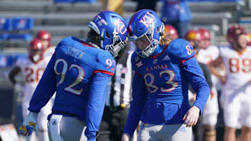 Oct 31, 2020; Lawrence, Kansas, USA; Kansas Jayhawks wide receiver Quentin Skinner (83) celebrates with Kansas Jayhawks punter Donovan Gagen (92) after scoring during the game against the Iowa State Cyclones at David Booth Kansas Memorial Stadium. Mandatory Credit: Denny Medley-USA TODAY Sports