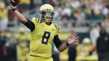 Sep 14, 2013; Eugene, OR, USA; Oregon Ducks quarterback Marcus Mariota (8) throws the ball in the second half against the Tennessee Volunteers at Autzen Stadium. Mandatory Credit: Scott Olmos-USA TODAY Sports