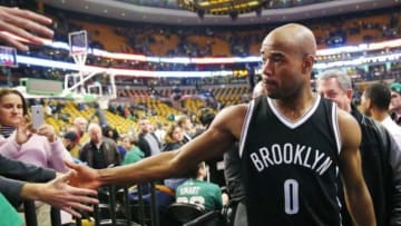Dec 26, 2014; Boston, MA, USA; Brooklyn Nets guard Jarrett Jack (0) is congratulated by fans after their 109-107 win over the Boston Celtics at TD Garden. Mandatory Credit: Winslow Townson-USA TODAY Sports