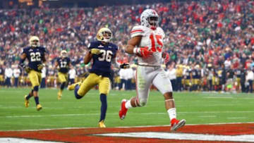 Jan 1, 2016; Glendale, AZ, USA; Ohio State Buckeyes running back Ezekiel Elliott (15) runs into the end zone for a second half against the Notre Dame Fighting Irish during the 2016 Fiesta Bowl at University of Phoenix Stadium. The Buckeyes defeated the Fighting Irish 44-28. Mandatory Credit: Mark J. Rebilas-USA TODAY Sports