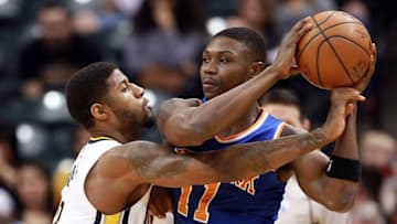 Apr 12, 2016; Indianapolis, IN, USA; Indiana Pacers forward Paul George (13) guard New York Knicks forward Cleanthony Early (11) at Bankers Life Fieldhouse. Mandatory Credit: Brian Spurlock-USA TODAY Sports