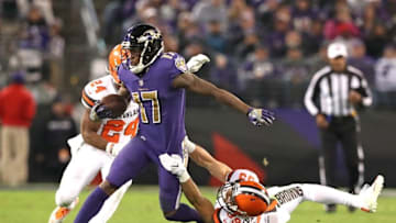 Nov 10, 2016; Baltimore, MD, USA; Baltimore Ravens wide receiver Mike Wallace (17) runs with the football tackled by Cleveland Browns defender Ed Reynolds (39) at M&T Bank Stadium. Mandatory Credit: Mitch Stringer-USA TODAY Sports
