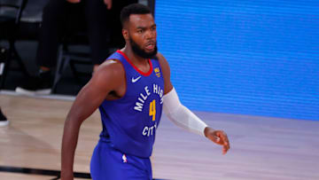 LAKE BUENA VISTA, FLORIDA - AUGUST 23: Paul Millsap #4 of the Denver Nuggets celebrates a three point basket against the Utah Jazz during the second quarter in Game Four of the Western Conference First Round during the 2020 NBA Playoffs at AdventHealth Arena at ESPN Wide World Of Sports Complex on August 23, 2020 in Lake Buena Vista, Florida. NOTE TO USER: User expressly acknowledges and agrees that, by downloading and or using this photograph, User is consenting to the terms and conditions of the Getty Images License Agreement. (Photo by Kevin C. Cox/Getty Images)