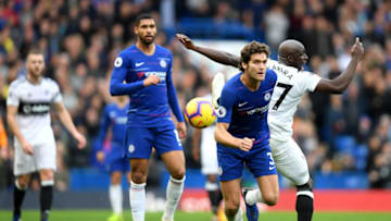 LONDON, ENGLAND - DECEMBER 02: Marcos Alonso of Chelsea battles for possession with Aboubakar Kamara of Fulham during the Premier League match between Chelsea FC and Fulham FC at Stamford Bridge on December 2, 2018 in London, United Kingdom. (Photo by Mike Hewitt/Getty Images)