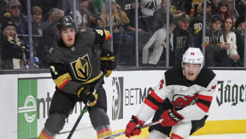 LAS VEGAS, NEVADA - MARCH 03: Zach Whitecloud #2 of the Vegas Golden Knights passes against Joey Anderson #14 of the New Jersey Devils in the first period of their game at T-Mobile Arena on March 3, 2020 in Las Vegas, Nevada. The Golden Knights defeated the Devils 3-0. (Photo by Ethan Miller/Getty Images)