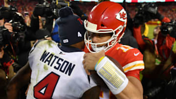 KANSAS CITY, MISSOURI - JANUARY 12: Quarterbacks Patrick Mahomes #15 of the Kansas City Chiefs and Deshaun Watson #4 of the Houston Texans embrace after Chiefs win the AFC Divisional playoff game 51-31 at Arrowhead Stadium on January 12, 2020 in Kansas City, Missouri. (Photo by Peter Aiken/Getty Images)