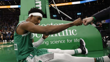 Jan 31, 2022; Boston, Massachusetts, USA; Boston Celtics guard Josh Richardson (8) fist bumps a fan after making a basket against the Miami Heat during the second half at TD Garden. Mandatory Credit: Winslow Townson-USA TODAY Sports