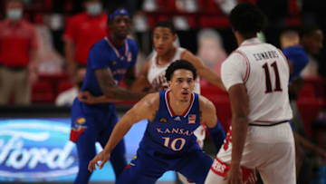 Dec 17, 2020; Lubbock, Texas, USA; Texas Tech Red Raiders guard Kyler Edwards (11) looks for an opening against Kansas Jayhawks forward Jalen Wilson (10) in the second half at United Supermarkets Arena. Mandatory Credit: Michael C. Johnson-USA TODAY Sports