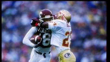 1 Jan 1992: Wide receiver Brian Mitchell of the Texas A&M Aggies tries to fend off defensive back Terrell Buckley of the Florida State Seminoles during the Cotton Bowl at the Cotton Bowl in Dallas, Texas. Florida State won the game 10-2. Mandatory Credit: Mike Powell /Allsport
