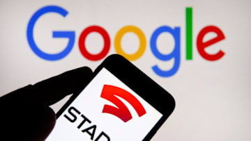 PARIS, FRANCE - NOVEMBER 18: In this photo illustration, the Stadia logo is displayed on the screen of an iPhone in front of a computer screen displaying the Google logo on November 18, 2019 in Paris, France. Stadia is a streaming platform for on-demand video games in the cloud. Introduced by Google on the sidelines of the Game Developer Conference 2019, the service allows you to play AAA video games on all kinds of devices, such as a computer, phone, tablet or Chromecast. The service will be launched by Google tomorrow November 19, 2019 in 14 countries, including France. (Photo by Chesnot/Getty Images)