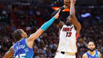 Bam Adebayo #13 of the Miami Heat shoots over P.J. Washington #25 of the Charlotte Hornets(Photo by Michael Reaves/Getty Images)
