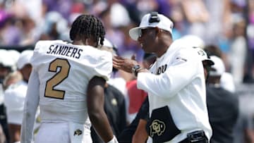 Sep 2, 2023; Fort Worth, Texas, USA; Colorado Buffaloes head coach Deion Sanders talks to quarterback Shedeur Sanders (2) after a touchdown in the fourth quarter against the TCU Horned Frogs at Amon G. Carter Stadium. Mandatory Credit: Tim Heitman-USA TODAY Sports