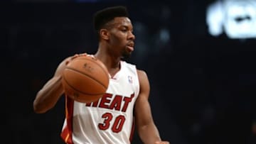 Jan 10, 2014; Brooklyn, NY, USA; Miami Heat point guard Norris Cole (30) dribbles against the Brooklyn Nets at Barclays Center. The Brooklyn Nets won the game 104-95 in double overtime. Mandatory Credit: Joe Camporeale-USA TODAY Sports