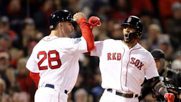 BOSTON, MA - OCTOBER 23: Eduardo Nunez #36 of the Boston Red Sox is congratulated by his teammate J.D. Martinez #28 after his three-run home run during the seventh inning against the Los Angeles Dodgers in Game One of the 2018 World Series at Fenway Park on October 23, 2018 in Boston, Massachusetts. (Photo by Maddie Meyer/Getty Images)