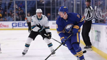 Jan 6, 2022; Buffalo, New York, USA; Buffalo Sabres defenseman Henri Jokiharju (10) looks to make a pass during the third period against the San Jose Sharks at KeyBank Center. Mandatory Credit: Timothy T. Ludwig-USA TODAY Sports