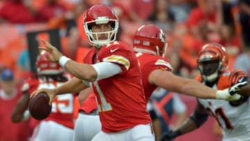 Aug 7, 2014; Kansas City, MO, USA; Kansas City Chiefs quarterback Alex Smith (11) throws a pass during the first quarter against the Cincinnati Bengals at Arrowhead Stadium. Mandatory Credit: Denny Medley-USA TODAY Sports
