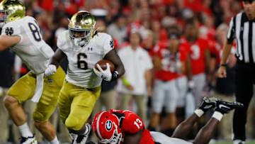 ATHENS, GEORGIA - SEPTEMBER 21: Tony Jones Jr. #6 of the Notre Dame Fighting Irish tries to out run the tackle of Azeez Ojulari #13 of the Georgia Bulldogs after a fist half catch at Sanford Stadium on September 21, 2019 in Athens, Georgia. (Photo by Kevin C. Cox/Getty Images)