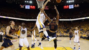 Jun 5, 2016; Oakland, CA, USA; Cleveland Cavaliers center Tristan Thompson (13) shoots the ball against Golden State Warriors center Andrew Bogut (12) during the fourth quarter in game two of the NBA Finals at Oracle Arena. Mandatory Credit: Ezra Shaw-Pool Photo via USA TODAY Sports