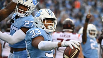 Oct 1, 2022; Chapel Hill, North Carolina, USA; North Carolina Tar Heels linebacker Cedric Gray (33) reacts after intercepting the ball in the second quarter at Kenan Memorial Stadium. Mandatory Credit: Bob Donnan-USA TODAY Sports