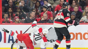 Feb 18, 2016; Ottawa, Ontario, CAN; Ottawa Senators right wing Mark Stone (61) checks Carolina Hurricanes center Riley Nash (20) in the first period at the Canadian Tire Centre. Mandatory Credit: Marc DesRosiers-USA TODAY Sports