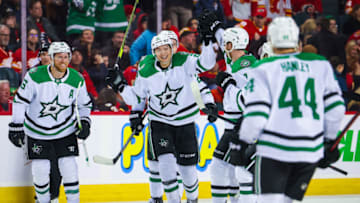 Mar 18, 2023; Calgary, Alberta, CAN; Dallas Stars left wing Jason Robertson (21) celebrates his goal with teammates against the Calgary Flames during the overtime period at Scotiabank Saddledome. Mandatory Credit: Sergei Belski-USA TODAY Sports