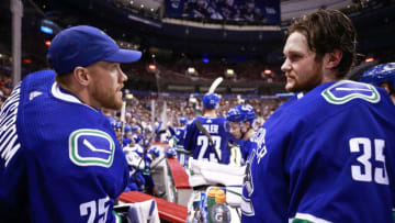 VANCOUVER, BC - MARCH 28: Jacob Markstrom #25 talks to Thatcher Demko #35 of the Vancouver Canucks during their NHL game against the Los Angeles Kings at Rogers Arena March 28, 2019 in Vancouver, British Columbia, Canada. (Photo by Jeff Vinnick/NHLI via Getty Images)"n