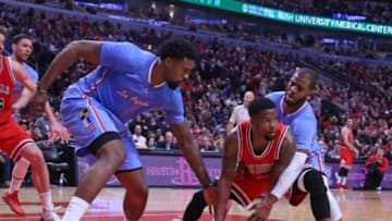 Mar 1, 2015; Chicago, IL, USA; Chicago Bulls guard Aaron Brooks (center) fights for the ball with Los Angeles Clippers center DeAndre Jordan (left) and guard Chris Paul (right) during the second half at the United Center. The Clippers won 96-86. Mandatory Credit: Dennis Wierzbicki-USA TODAY Sports